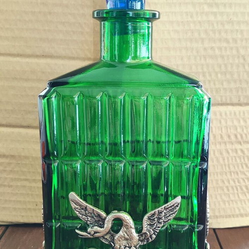 Vintage Italian glass bottle in metal base like new