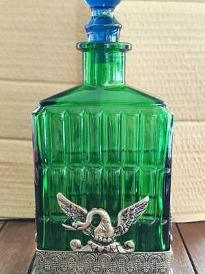 Vintage Italian glass bottle in metal base like new