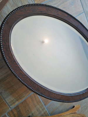 Mirror used with wooden oval frame