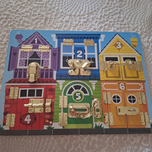 Melissa and Doug Activity Board like new, wooden with locks