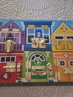 Melissa and Doug Activity Board like new, wooden with locks