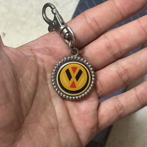 Volkswagen vintage metal keychain with classic logo, used