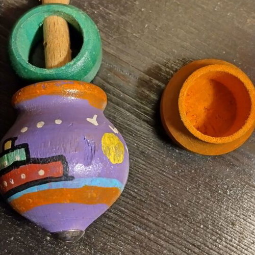Old wooden toys like new, handmade spinning top and wooden animal