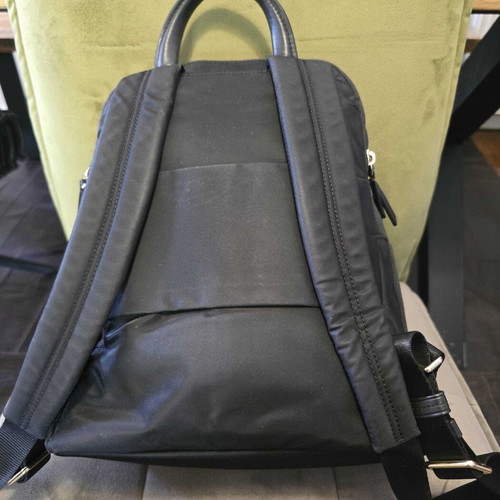 Tumi backpack used, black with gold details