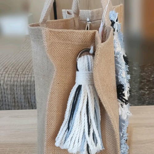 Jute bag with knitted decorative eye and waterproof lining