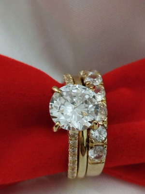 Rings three new size 7.5 with white synthetic zircons, gold plated