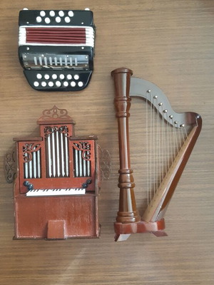 Set of miniature musical instruments like new, wood and plastic