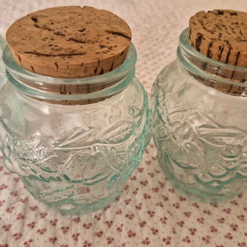 Glass jars like new, set of 4 with embossed designs