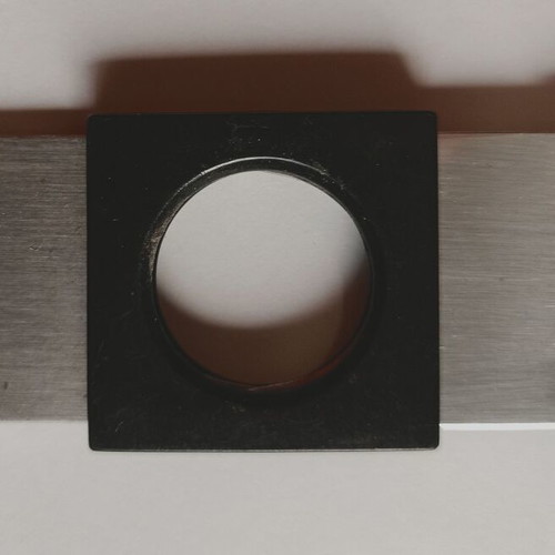 Black plastic cigar cutter used with metal cutting edges