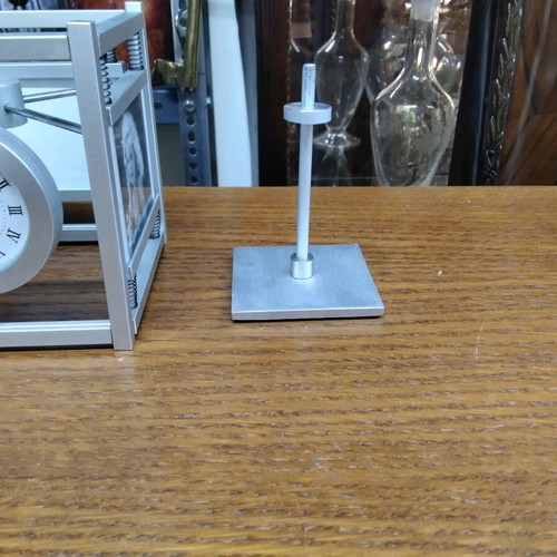 Quartz table clock silver color rotating, like new