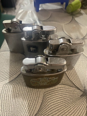 Lot of 4 used petrol lighters, various brands