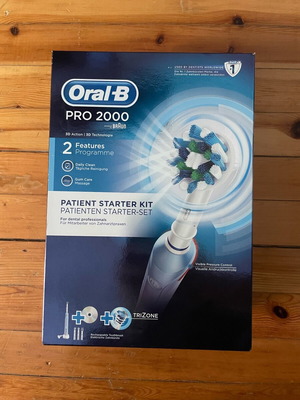 Oral B Pro 2000 electric toothbrush new with 4 heads, timer and pressure sensor