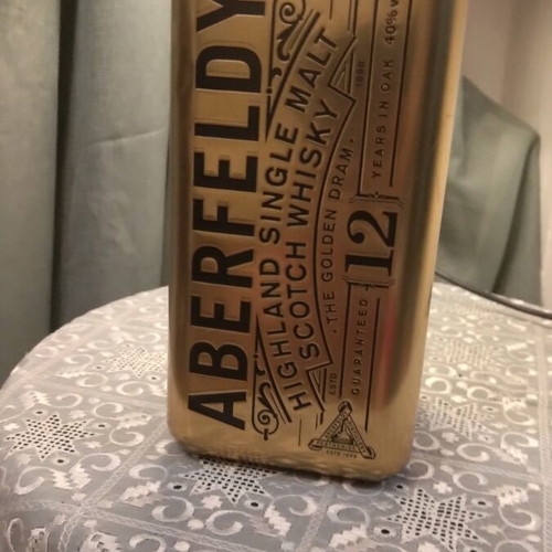 Metal Bottle Case like new with collectible bottle