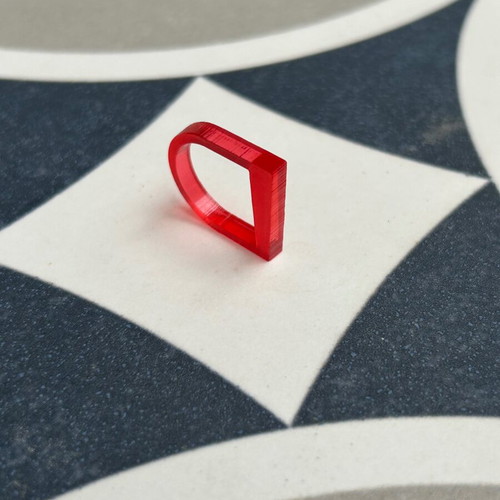 Plexiglass ring like new with red transparent color and unique design