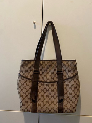Gucci brown hand bag used with dust bag and visible wear