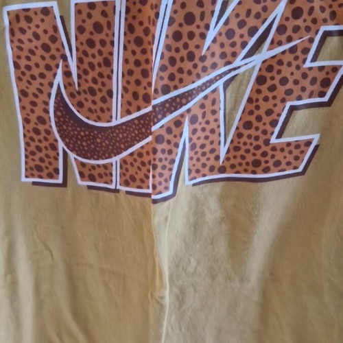 Nike t-shirt like new mustard color with animal print