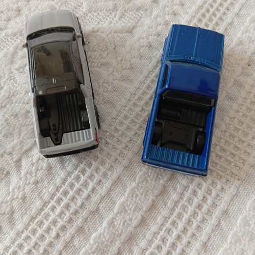 Hot Wheels Chevy Silverado and Chevrolet Silverado EV toy cars like new, pack of 2