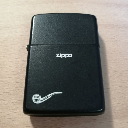 Zippo lighter used, black with graphic design