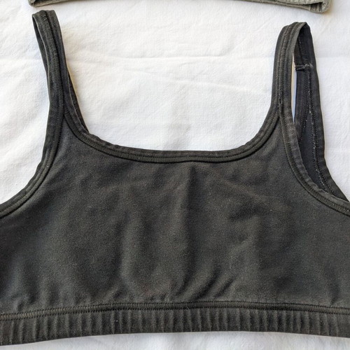 Bdtk two used sports bras size Medium, black and gray