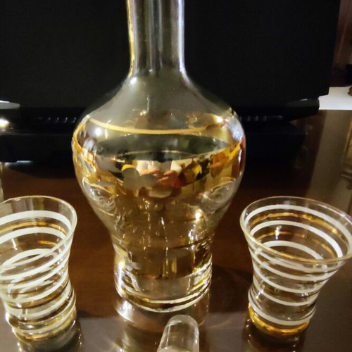 Vintage glass decanter set with 2 glasses used, gold decorations