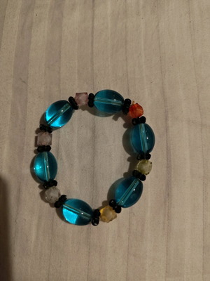 Bracelet with blue stones like new, elastic