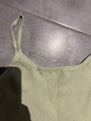 Ribbed green top with thin straps and subtle rhinestones