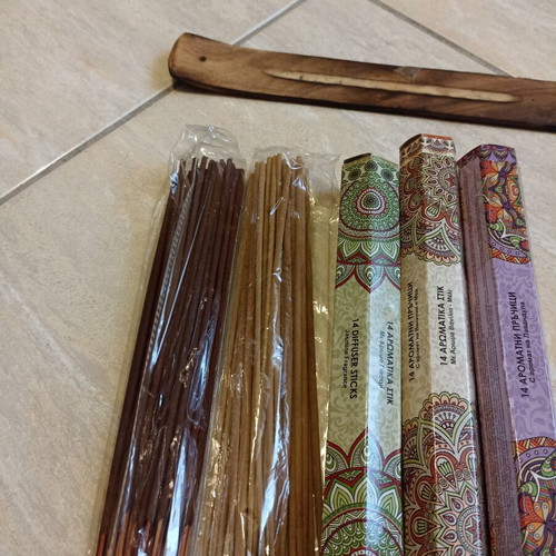 Aromatic incense sticks with wooden base, assorted scents
