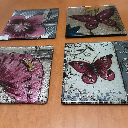 Glass coasters used, set of 4, butterfly and flower designs