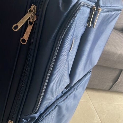 Large suitcase like new, blue, with 360-degree wheels and lock system