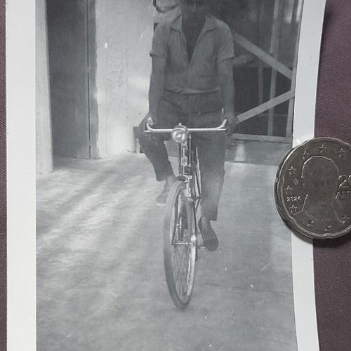Vintage black and white photo of man with bicycle, like new