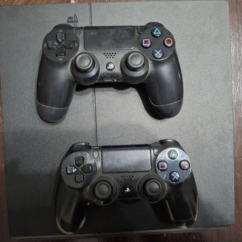 PlayStation 4 console used with 2 controllers, 11 games and cooling stand