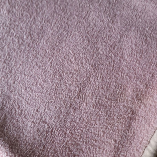 Single blanket used, pink with burn mark