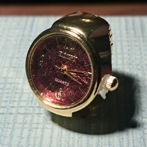 Quartz ring watch like new with purple dial and gold bracelet
