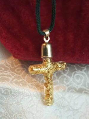 Cross with pure gold leafs in solution, metal