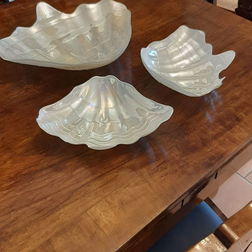 Three platters in the shape of a conch