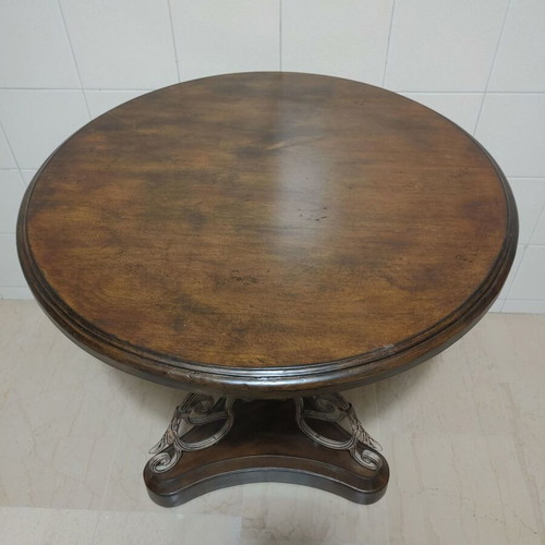 Round wooden table with metal leg, vintage style