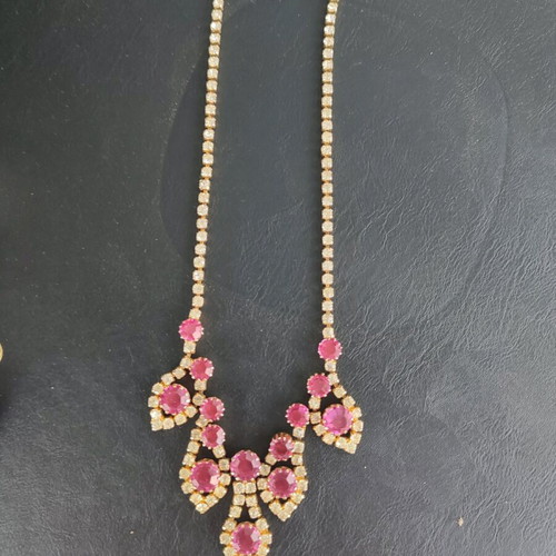 Antique necklace used with pink stones and gold rhinestones