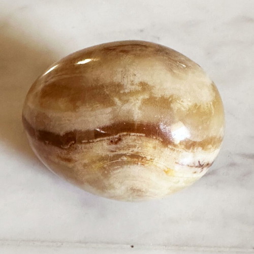 Vintage decorative egg from natural onyx stone in carved silver-plated base used