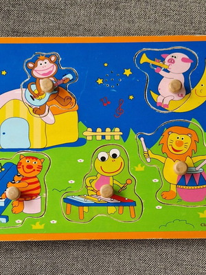 Wooden puzzle peg toy used with musical animals no sound