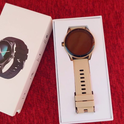 Smart watch, gold with beige strap and black with extra straps