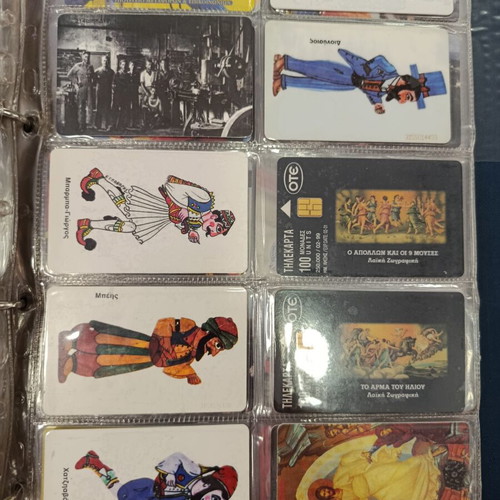 Phone card album with approximately 400 used Greek cards