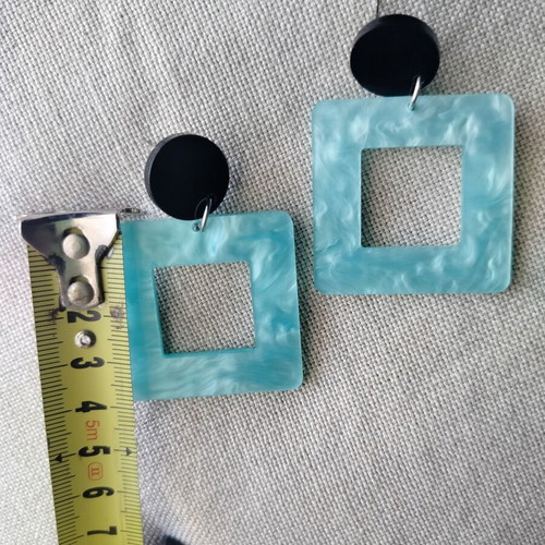 Statement earrings with aquamarine swirl resin square and black round base