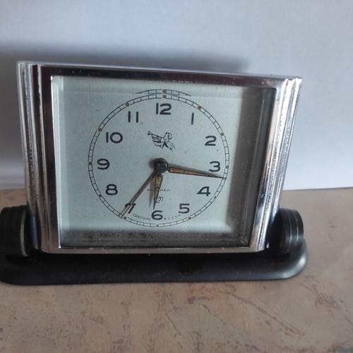 Slava mechanical alarm clock used, analog table clock
