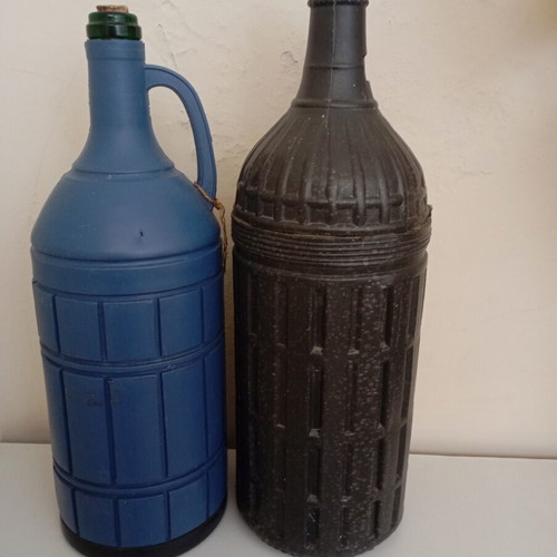 Glass bottles set of 2 used, one with moisture marks