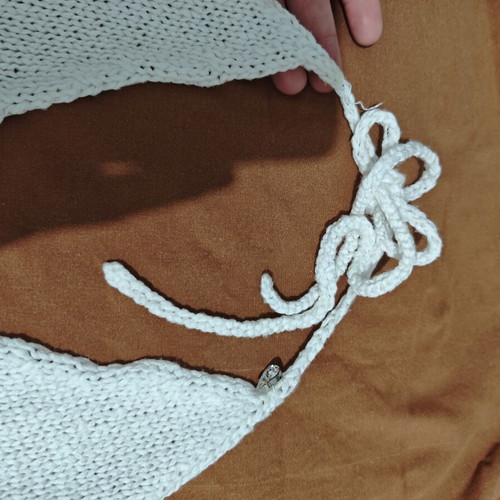 White knitted halterneck top used, size S-M, decorated with ribbons and beads