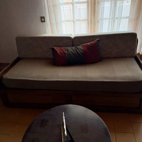 Two sofa beds and table set
