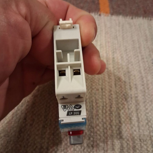 Legrand rail-mounted button switch with indicator light