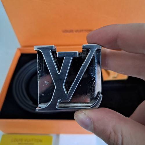 Louis Vuitton leather belt with interchangeable buckles