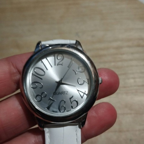 Women's watch used with white leather strap