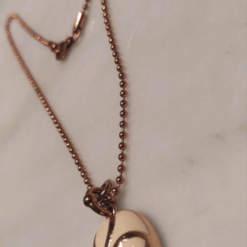 Folli Follie necklace used pink gold plated oval cross with floral design
